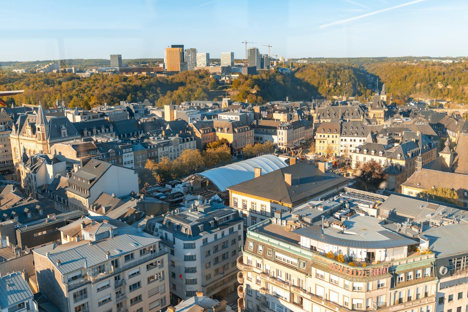 Cityscape with historic buildings and modern skyscrapers.